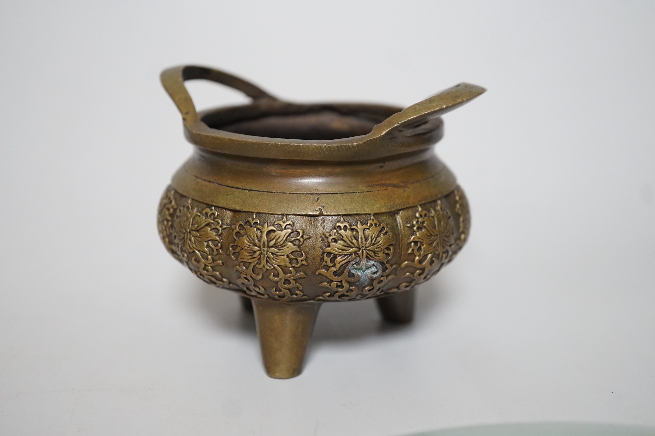 A pair of Chinese celadon ground famille rose plates, a Chinese famille rose tea pot and a bronze censer, plates 26cms diameter